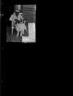 Older woman sitting on porch in rocker (1 Negative), undated [Sleeve 16, Folder c, Box 45]